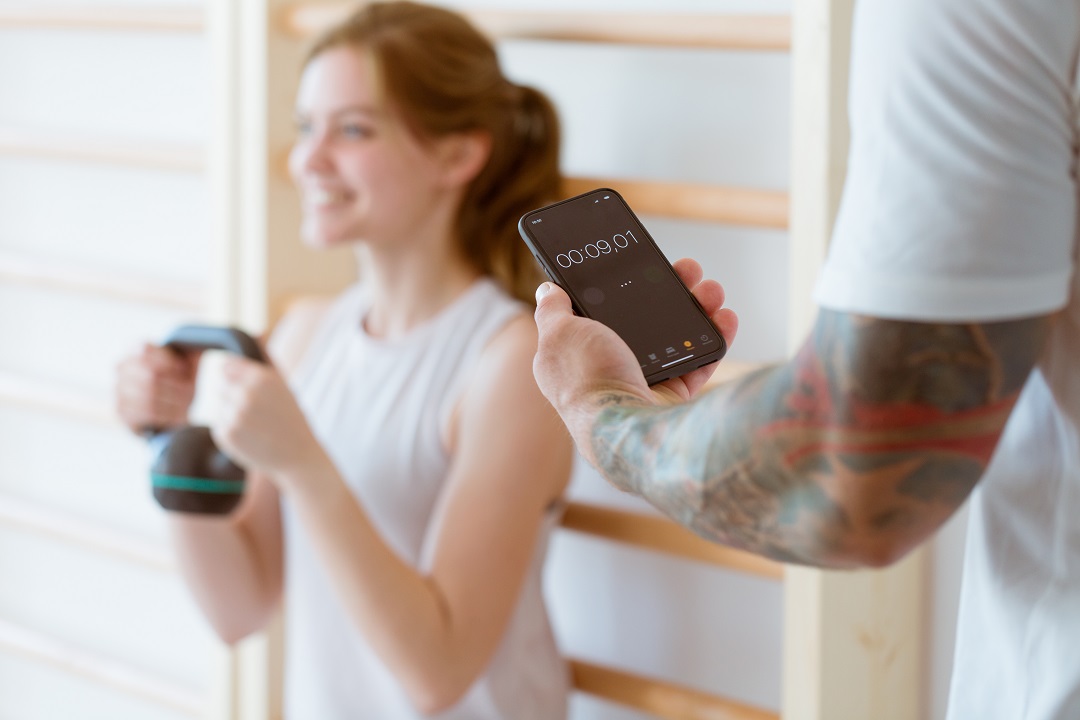 Rehab therapist utilizing future trends in AI scribe technology with patient