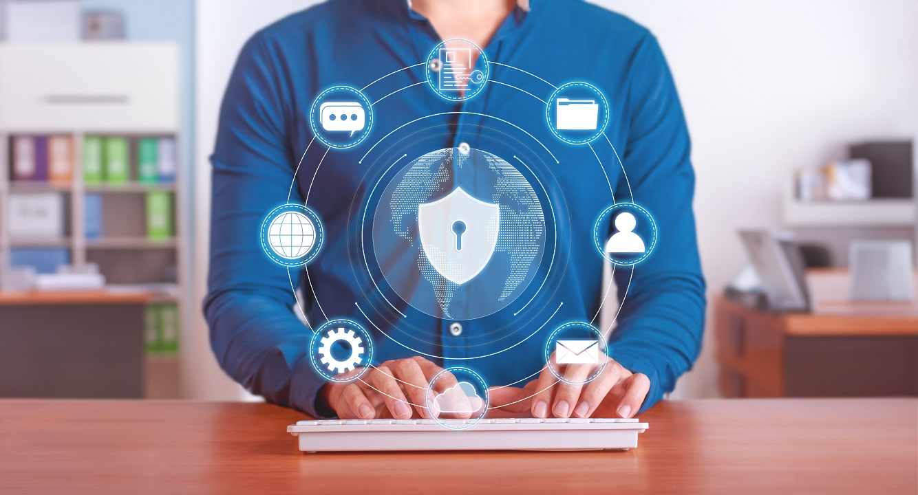 Person typing on keyboard while implementing AI medical scribe data security protocols