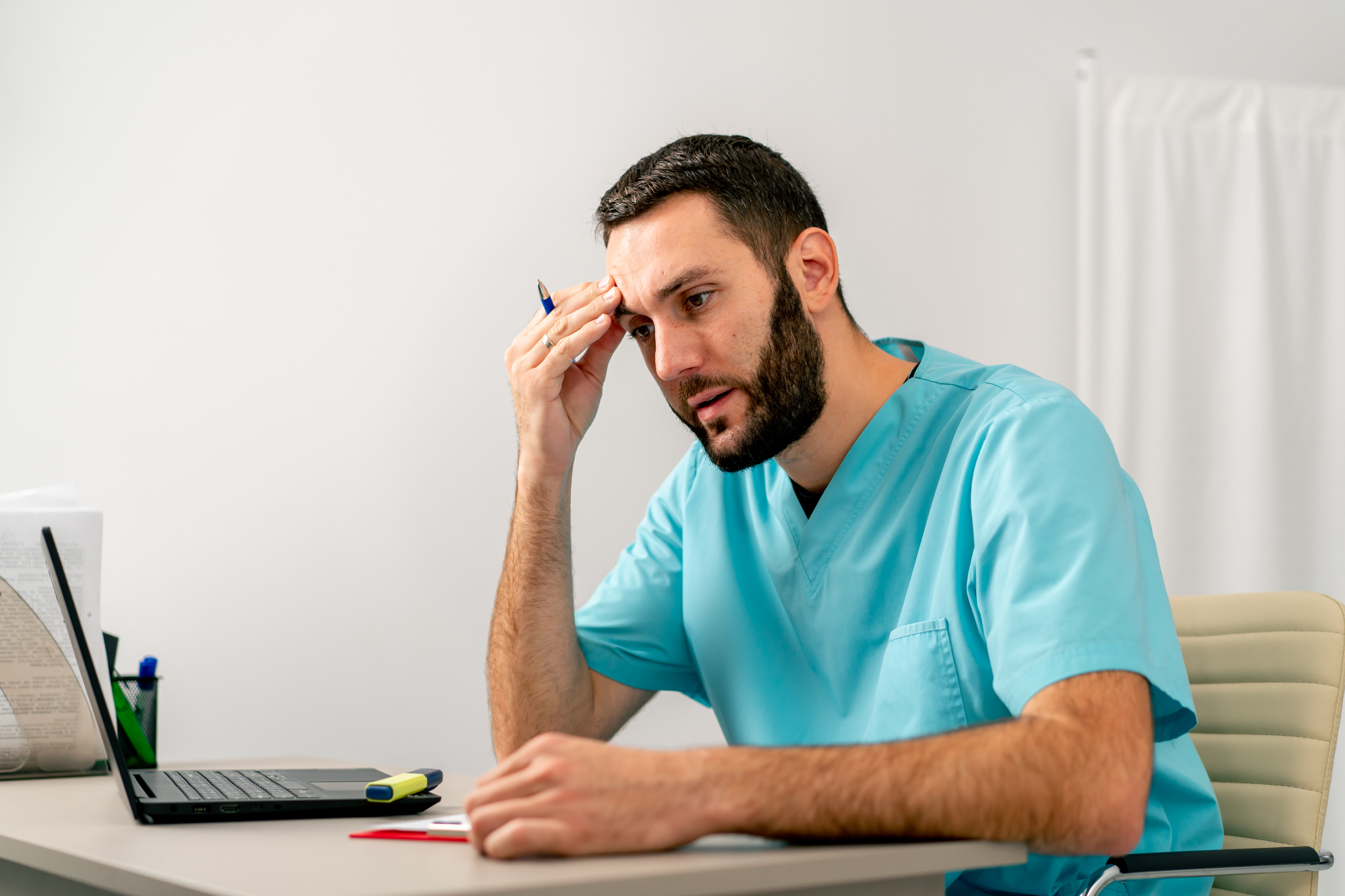 therapist in a uniform-sits in a medical office