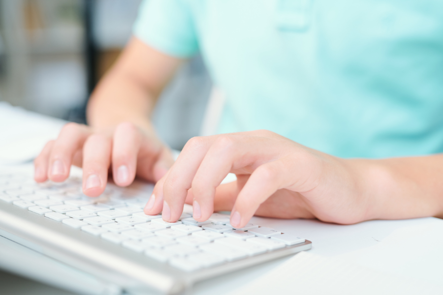 therapist typing on the keyboard